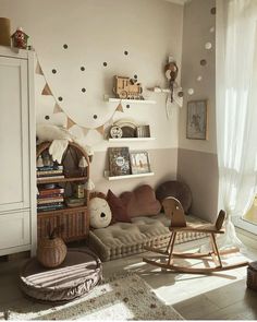 a living room filled with lots of furniture and decor on top of a white wall