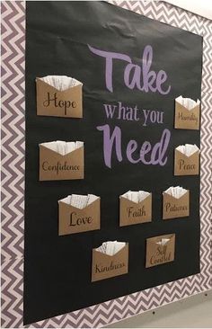 a bulletin board that says take what you need with some paper bags on the front