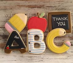 decorated cookies in the shape of letters and numbers