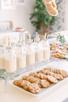 there are cookies and milk on the table