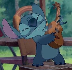 stitch is playing the guitar while sitting on a chair in disney's lili