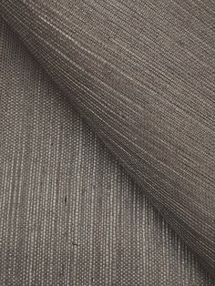 a close up shot of the fabric in grey and white stripes on a gray background