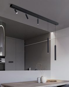 a kitchen with a wooden table and white walls