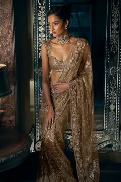 Buy Gold Net Embroidered Sequin Antique Tonal Saree With Blouse For Women by Seema Gujral Online at Aza Fashions. Gold Sequin Saree, Nepali Clothing, Blue Sequin Saree, Indian Fits, Traditional Glam, Gold Saree, Seema Gujral, Golden Saree, Character Wardrobe