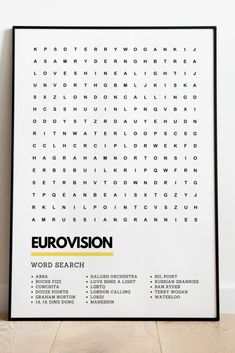 a black and white poster with the words eurolvision on it, in front of a wooden floor