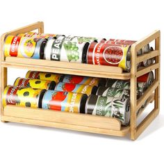 a wooden spice rack with six different types of spices in it on a white background