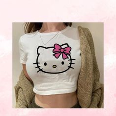 Turn Heads With Our Y2k Hello Kitty Crop Top, A Must-Have For Any Trendsetter. This Top Brings Nostalgic Vibes With A Modern Twist. Plus, Enjoy A Free Sticker With Every Purchase! Thank You In Advance For Your Orderwe Can't Wait For You To Rock This Look! If You Need Any Help, Feel Free To Reach Out. We’re Here For You! Tshirt Crop Top, Tshirt Crop, Kawaii T Shirt, Hello Kitty T Shirt, Sporty Crop Top, Y2k Hello Kitty, Beige Crop Tops, Cropped Tee Shirt, Graphic Crop Top