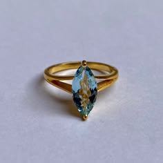 ## **Refined Custom Blue Aquamarine Gold Birthstone Ring** Discover the most distinctive and classy jewelry available, a perfect gift for you and your loved ones. Why You'll Love It? - It's refined, suitable for everyday wear. - A special piece you'll always treasure. - Guaranteed high-quality material. About The Birthstone Ring: This listing is for a single aquamarine pendant. If you desire a set of pendants and rings, simply adjust the quantity at check out. - Stone Dimensions and Weight: 13 x Yellow Gold Rings With Blue Topaz For Formal Occasions, Formal Yellow Gold Rings With Blue Topaz, Formal Yellow Gold Ring With Blue Topaz, Luxury 14k Gold Hallmarked Topaz Ring, Gift Marquise Diamond Cut Sapphire Ring, Formal Solitaire Topaz Birthstone Ring, Marquise Sapphire Ring With Vvs Clarity For Formal Occasions, Formal Marquise Yellow Gold Emerald Ring, Formal Marquise Sapphire Ring With Vvs Clarity