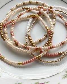 5-EA  3mm seed bead bracelets (mix of matte gold, rose, cream and white) Gold Seed Bead Bracelet, Elastic Seed Bead Bracelets Diy, Bracelet Color Combos Beads, Seed Bead Bracelets Ideas Color Combos, Seed Bead Bracelets Ideas, Seed Bead Bracelets Diy, Money Jewelry, Boho Bracelets Stack, Small Bead Bracelet