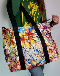 A big ‘ol canvas beach bag…that’s bold, bright, and covered in my Page o’ Plumeria painting. This sucker is a beauty, and it was about time I made a beach bag. The deets: Size: 22" x 17" with a 25" handle (53.75 x 41.25 cm with a 62 cm handle.) Fabric: Made of 100% Certified O Goldfish Kiss, Field Bag, Large Beach Bags, Canvas Beach Bag, Duck Canvas, Beach Bag, Inside Pocket, Zip Pockets, Organic Cotton