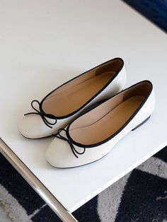 Editor's NotesNONETHELESS's simple and casual shoes will stand out your daily outlook.- Lovely ribbon point - Cute round shaped toe- Feminine and classic silhouette- Soft and durable leather textureMeasurements(in.)- Size: KR 220MM (US 5) - KR 255MM (US 8.5)- Heel Height: 0.39 in.*Fits true to the size.Composition & Care- Lambskin- Do not wash- Professional shoe cleaning is neededDesigner- by NONETHELESS Classic White Leather Ballet Flats, Chic White Ballet Flats With Round Toe, Classic White Pointed Toe Ballet Flats, Classic Cream Ballet Flats With Round Toe, White Classic Ballet Flats, White Elegant Ballet Flats For Everyday, Classic White Low Heel Ballet Flats, Classic White Ballet Flats With Low Heel, White Low Heel Ballet Flats For Work