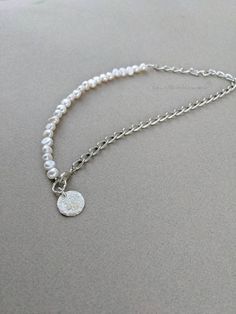 This handmade necklace is made from cultivated pearls attached to a silver chain section, with a small coin charm at the clap. All metal pieces of this necklace are sterling silver plated! This necklace works well as a stackable necklace with a length of 19.5" as a good medium length necklace. *This item is one of a kind and no exact duplicates will be made* Please contact us for any questions or for international shipping options! Exact color may slightly differ in person, due to screen photos are being viewed on. Stackable Necklaces, Fayetteville Nc, Silver Coin, Silver Coins, Handmade Necklace, Handmade Necklaces, Chains Necklace, Necklace Etsy, Silver Chain