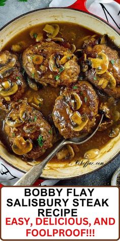 a pot filled with meat and mushrooms in gravy on top of a table