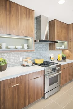 a kitchen with wooden cabinets and stainless steel appliances