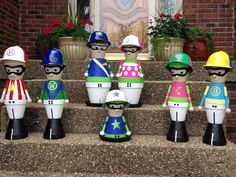 a group of toy figurines sitting on the steps