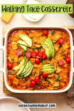 a casserole dish with tomatoes, avocado and tortilla chips