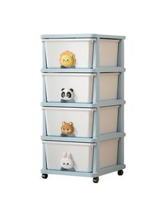 the toy chest has four drawers with animals on it and is painted in light blue