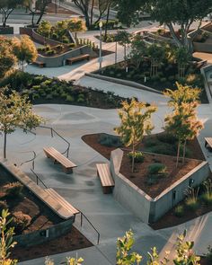 an aerial view of a park with benches and trees