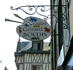 a sign on the side of a building that says gerard boudiin in french