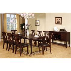 a dining room table with chairs and a chandelier