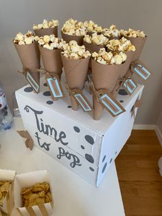 popcorn cones are stacked on top of a box