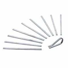 an assortment of metal tools on a white background