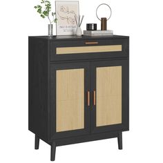 a black cabinet with wicker doors and drawers