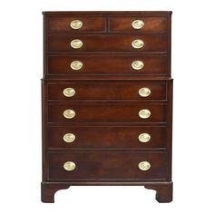 an antique chest of drawers with brass knobs on the top and bottom, against a white background