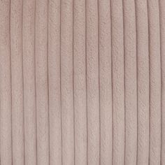 a close up view of the texture of a beige fabric with pleated lines on it