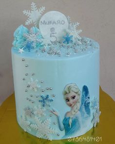 a frozen princess cake with snowflakes on it