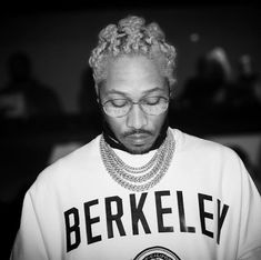 a man with glasses and a t - shirt that says berkley on it