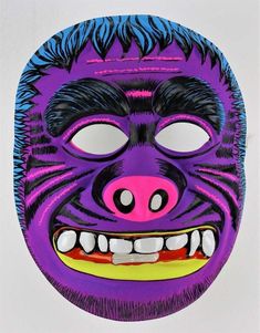 a purple mask with an animal's face painted on it