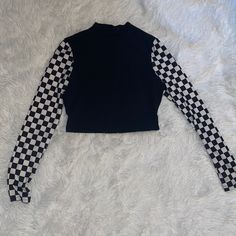 Purchased About 2 Years Ago But Never Worn Personally By Me. Unique Checkered Print Pattern Down Sleeves While The Rest Of The Top Is A True Black! Cropped Length, Size Medium, Mockneck Opening On Top. Perfect For Anybody Who Still Rocks This Type Of Style! Send Offers! Will Accept Reasonable Offers :) I Usually Ship The Next Day, 2 Days At Most! Black Stretch Top With Patchwork, Black Stretch Patchwork Top, Stretch Black Patchwork Tops, Black Fitted Patchwork Top, Fitted Black Tops With Patchwork, Fitted Casual Cropped Mock Neck Top, Casual Black Mock Neck Top, Stretch High Neck Top With Graphic Print, Black Fitted Turtleneck Top