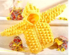 a crocheted sweater and booties is featured in the knitting pattern for an infant's coat