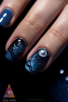 Mystical moonlit nights on your nails! This moon and stars nail art features a dark blue background with a glowing moon and tree silhouettes, perfect for those who love enchanting designs. Discover more at nailhow.com. Night Sky Nails