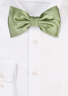 This sage solid bow tie in a solid sage color is sure to become your go-to new favorite accessory for your blue suits. The deep green color is brought out to its full potential when paired with a jacket in a darker shade of blue, such as navy or midnight blue. This bow tie is ideal for both informal and formal settings due to the satin finish fabric from which it is constructed. The fabric exudes a magnificent sheen, making it suitable for both settings. Deep Green Color, Blue Suits, Sage Color, Dark Shades, Blue Suit, Full Potential, Deep Green, The Deep, Satin Finish