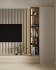 a living room with a large television mounted on the wall and bookshelves in front of it