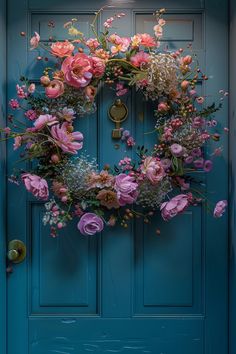 a blue door with a pink wreath on it