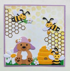 a card with bees and honeycombs on the front, one bear holding a beehive