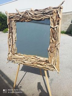 a wooden frame made out of drift wood