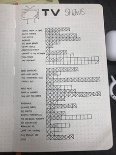 an open notebook with crossword puzzles on it