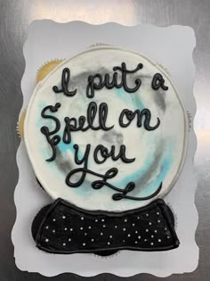 a cake with writing on it that says i put a spell on you