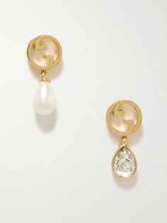 Gucci's 'Blondie' earrings have a cool, mismatched design - one is anchored by a sparkling crystal, while the other features a lustrous faux pearl. They've been made in Italy from gold-tone metal and shaped to resemble the iconic 'GG' emblems. Designer Gucci Jewelry With Matching Earrings, Gucci Gold Earrings For Formal Occasions, Designer Gucci Jewelry For Party, Luxury Gucci Earrings For Formal Occasions, Gucci Designer Jewelry With Matching Earrings, Gucci Jewelry Gift, Elegant Gucci Earrings For Gift, Gucci Pierced Jewelry As Gift, Classic Gucci Earrings