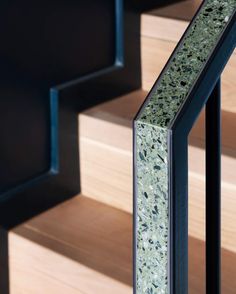 a close up view of some stairs with green and blue paint on it's sides