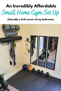 an indoor gym set up with mirrors and exercise equipment on the floor in front of it