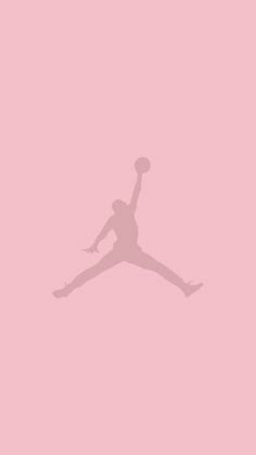 the silhouette of a basketball player is shown against a pink background