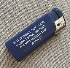 a lighter that is on the ground with some writing on it's end cap