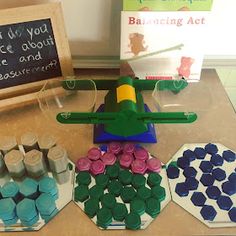 a table topped with lots of different colored items