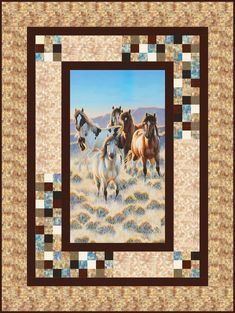 a quilt with horses running in the desert on it's side and an image of two