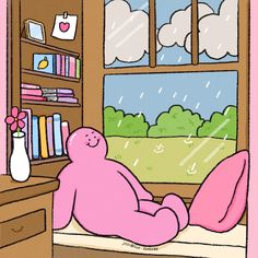 a pink teddy bear sitting on a window sill in front of a bookshelf